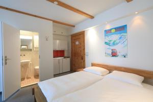 Postel nebo postele na pokoji v ubytování Hotel Concordia