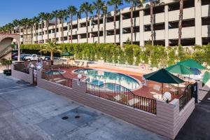 an image of a swimming pool at a hotel at Kings Inn Anaheim at The Park & Convention Center in Anaheim
