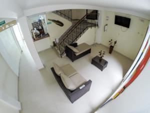 an overhead view of a living room with a couch and a tv at Hotel La Esperanza 2 in Leticia