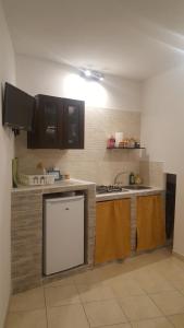 Kuchyňa alebo kuchynka v ubytovaní Room Calafatari