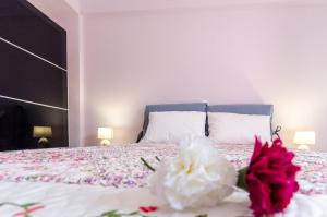 A bed or beds in a room at Leo - Unique Glyfada Apartment