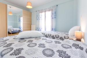 A bed or beds in a room at Leo - Unique Glyfada Apartment