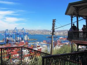 a view of a harbor from a balcony at Hostal Odeón in Valparaíso