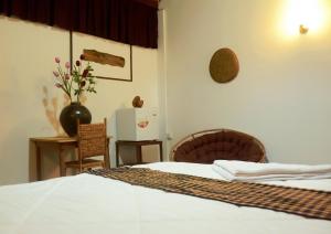Postel nebo postele na pokoji v ubytování Fish Island Bungalows