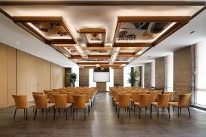 a conference room with chairs and a podium at Artyzen Habitat Dongzhimen Beijing in Beijing