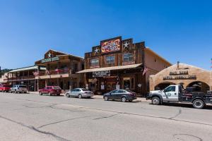 a city street with cars parked in front of buildings at Fort Davis Inn & RV Park in Fort Davis