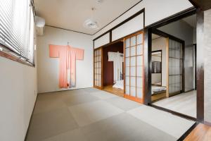 a room with a cross on the wall at Yukiya in Osaka