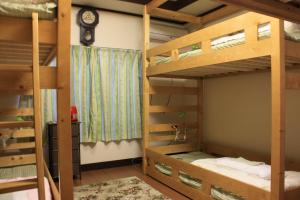 Postel nebo postele na pokoji v ubytování Guesthouse Seiryu Kibako