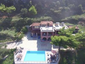 an aerial view of a house with a swimming pool at Villa Eora in Keri