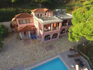 an aerial view of a house with a swimming pool at Villa Eora in Keri