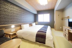 禦宿野乃難波天然溫泉酒店房間的床