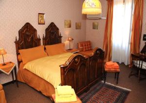 Postel nebo postele na pokoji v ubytování La Corte B&B