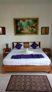Postel nebo postele na pokoji v ubytování Uma Loris Ubud