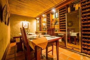 a dining room with a table and a wine cellar at Sondela Nature Reserve & Spa Country House in Bela-Bela
