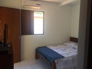 Postel nebo postele na pokoji v ubytování Chalé dos Milagres 01