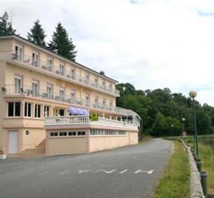 a large building on the side of a road at Logis Cosy - Hôtel Le Moulin Neuf - Chantonnay in Chantonnay