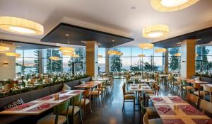 Reštaurácia alebo iné gastronomické zariadenie v ubytovaní Hotel Ičići - Liburnia