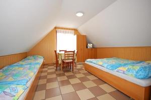 Un pat sau paturi într-o cameră la Rekreačný dom Polónyi