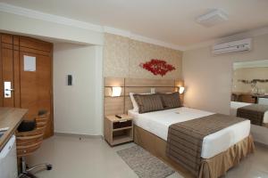 Cama ou camas em um quarto em BH Jaraguá Hotel