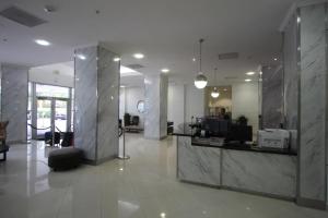 a lobby with a reception desk in a building at Ocean Reserve Piso 4 STR264 in Miami Beach