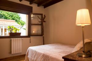 Postel nebo postele na pokoji v ubytování Casa Rural La Regoria