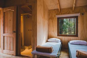 Letto o letti in una camera di Huilo Huilo Canopy Village