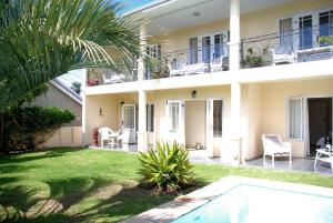 a view of the house from the yard at Mandalay Guest House Plettenberg Bay in Plettenberg Bay