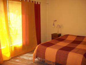 Una cama o camas en una habitación de Hosteria Aura Azul (ex Ser Azul)