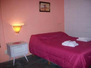Una cama o camas en una habitación de Hosteria Aura Azul (ex Ser Azul)