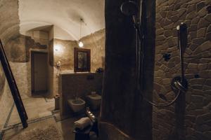 a bathroom with a sink and a toilet in a room at Casastella in Matera