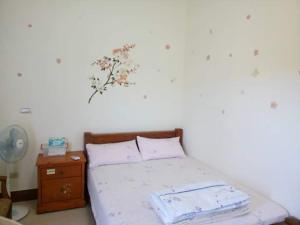 Postel nebo postele na pokoji v ubytování Xiang Pin Yuan Homestay