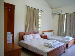 Postel nebo postele na pokoji v ubytování Xiang Pin Yuan Homestay