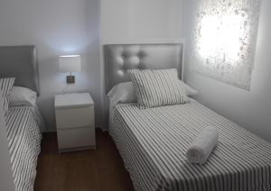 Posteľ alebo postele v izbe v ubytovaní Be Happy