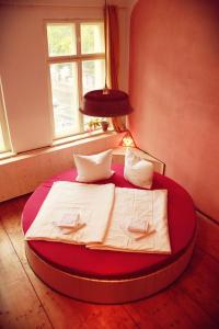Кровать или кровати в номере Spirit Lodge Leipzig