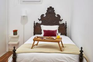 Katil atau katil-katil dalam bilik di Charming Apartment Marquês