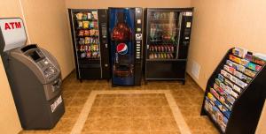 a soda machine and a drink cooler in a store at Howard Johnson by Wyndham Portsmouth in Portsmouth