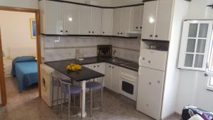 Kuchyň nebo kuchyňský kout v ubytování Casa Reyes Fataga
