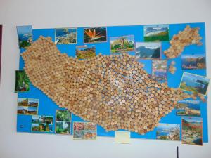 a wall with a picture of a heart made out of mushrooms at Marques House in Machico