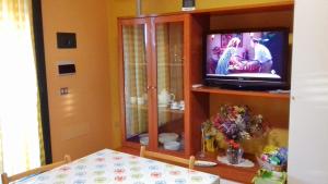 A television and/or entertainment centre at residence ulisse