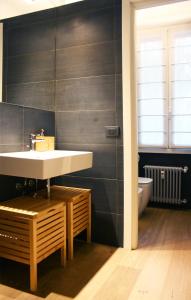 a bathroom with a sink and a toilet at Milano Navigli Apartment - Via Tortona in Milan