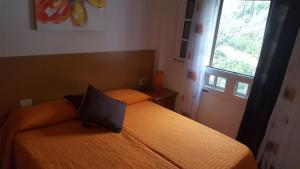 Postel nebo postele na pokoji v ubytování Casa Reyes Fataga