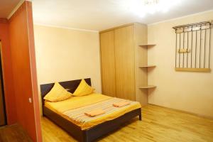 מיטה או מיטות בחדר ב-Apartments at Volgogradskiy prospekt