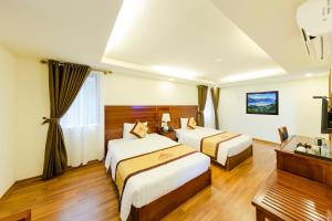 Giường trong phòng chung tại Sapa Lodge Hotel