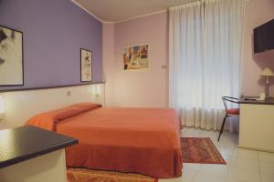 Postel nebo postele na pokoji v ubytování Hotel Rainero