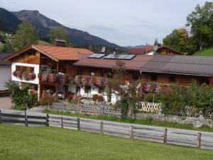 a house with solar panels on top of it at Badhaus in Achenkirch