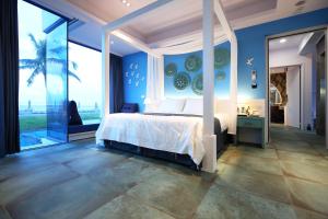 Postel nebo postele na pokoji v ubytování Hualien S.E.A. B&B