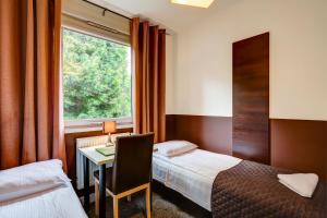 מיטה או מיטות בחדר ב-Smart2Stay Magnolia