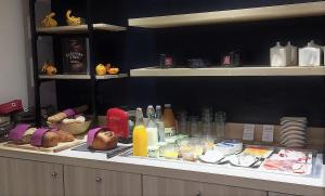 a buffet with a lot of food and candles at Hotel-Restaurant Lann Roz / Côte Cuisine in Carnac