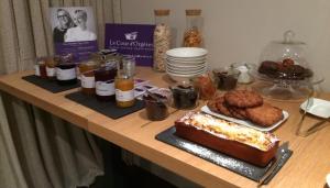 a table with a cake and other food on it at Hotel-Restaurant Lann Roz / Côte Cuisine in Carnac