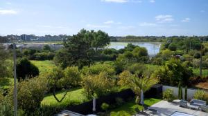 a view of the river from the roof of a house at Hotel-Restaurant Lann Roz / Côte Cuisine in Carnac